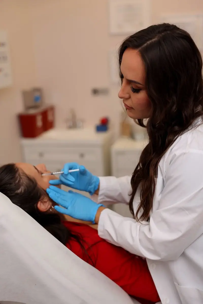 Anna Gryunshpan, NP, performing an injectable treatment at Annaré medical aesthetics, Tarzana CA
